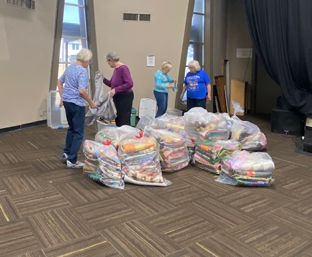 Sorting quilts for Distribution Night