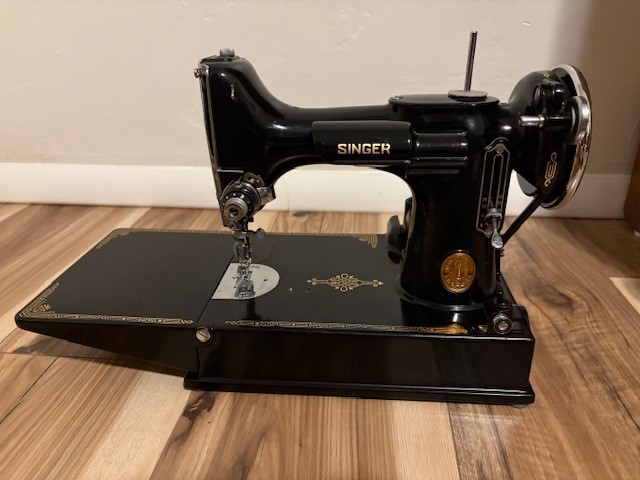 Featherweight sewing machine by Singer