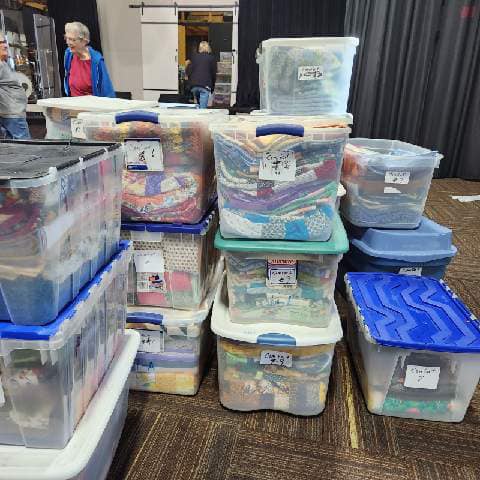 Quilts sorted and packed for distribution night