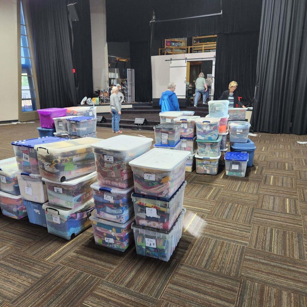 Quilts sorted and packed for distribution night